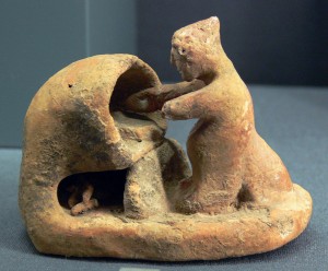 Antica miniatura greca di un forno e di un panettiere